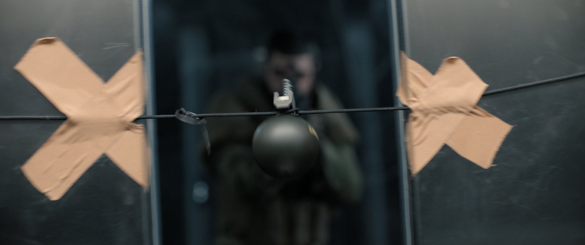 HD desktop wallpaper featuring a dramatic Extraction 2 movie scene with a tactical character in action behind a shattered glass.