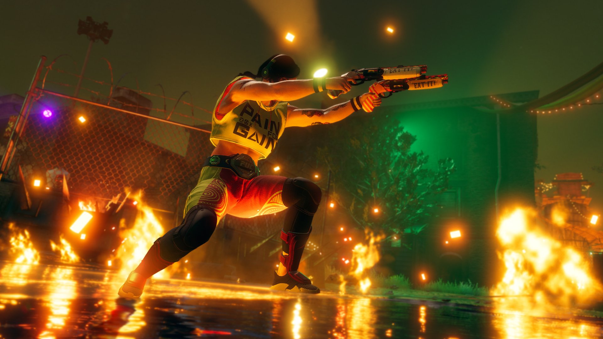 HD desktop wallpaper from Saints Row (2022) showing a character in dynamic gunfire action during a fiery night scene.