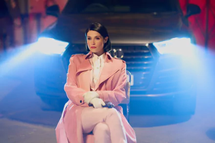Woman in pink trench coat sitting in front of a car with headlights on, mysterious night scene for desktop wallpaper tagged with culprits.