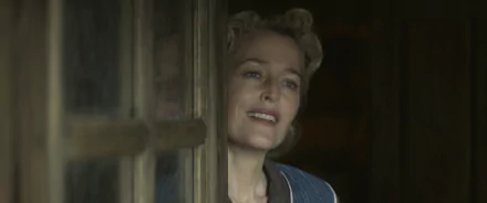 Gillian Anderson in a captivating scene from the movie White Bird, captured as a vibrant HD desktop wallpaper and background. A moment filled with emotion and warmth.