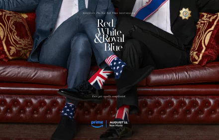 HD desktop wallpaper for the movie Red, White & Royal Blue, featuring close-up of elegantly dressed legs and shoes with British and American flags on a red sofa.