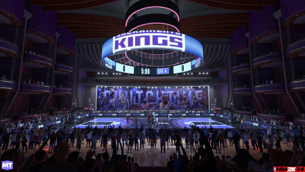 HD desktop wallpaper from NBA 2K24 featuring an animated indoor basketball stadium bustling with fans and prominent display of the Kings logo.