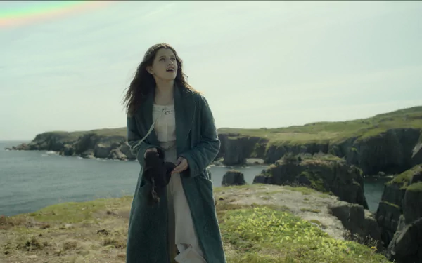 HD wallpaper featuring a Wendy-inspired character from Peter Pan, standing on a grassy cliff with the ocean in the background, reflecting the sense of adventure from the classic tale.