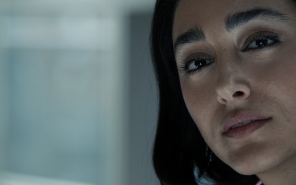 Close-up of a woman's face with a thoughtful expression, possibly from a scene in Extraction 2, suitable as an HD desktop wallpaper and background featuring Golshifteh Farahani.