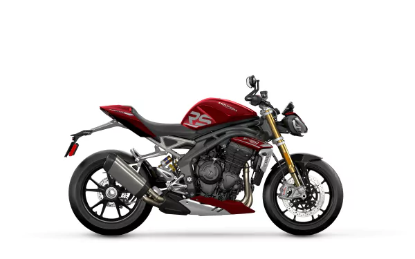 Triumph Speed Triple 1200 RS motorcycle in red and black color scheme, positioned as a high-resolution desktop wallpaper background.