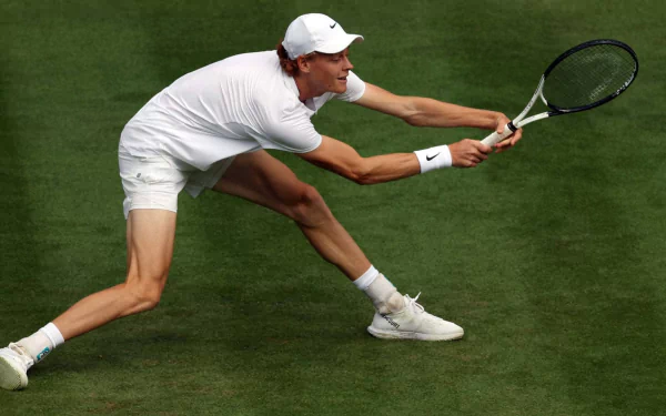 Tennis player reaching for a shot on the Wimbledon 2023 grass court, HD wallpaper.