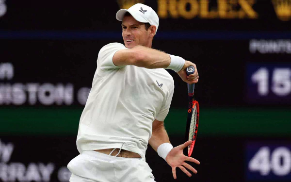 Andy Murray in action during Wimbledon 2023, showcasing his tennis skills in an HD sports wallpaper, capturing the intensity of the match.