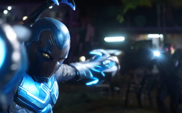 HD Wallpaper of Blue Beetle from DC Comics in action, perfect for desktop background.