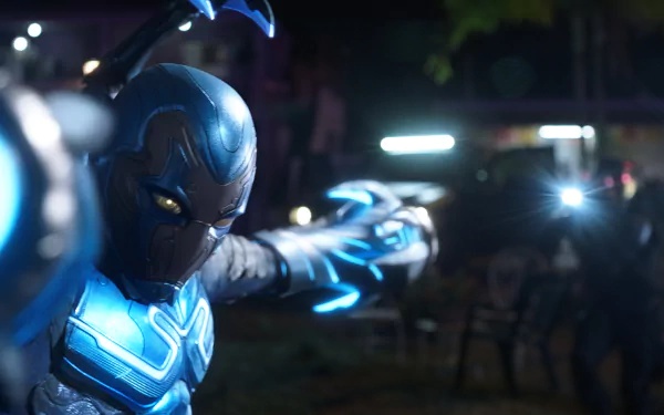 Jaime Reyes as Blue Beetle strikes a dynamic pose in this HD desktop wallpaper, showcasing the character's vibrant blue suit from the DC Comics movie.