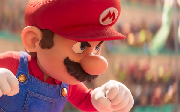 HD desktop wallpaper featuring a close-up of Mario from the 2023 movie Super Mario Bros., poised for action in a vivid, animated scene.