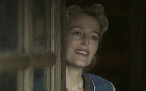 Gillian Anderson in a captivating scene from the movie White Bird, captured as a vibrant HD desktop wallpaper and background. A moment filled with emotion and warmth.