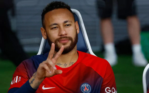 Football player in Paris Saint-Germain F.C. kit making peace sign – HD desktop wallpaper.