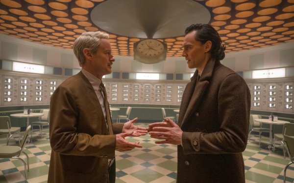 HD wallpaper featuring two characters from Loki Season 2 engaged in conversation in a retro-styled room, capturing the essence of the series for desktop backgrounds.