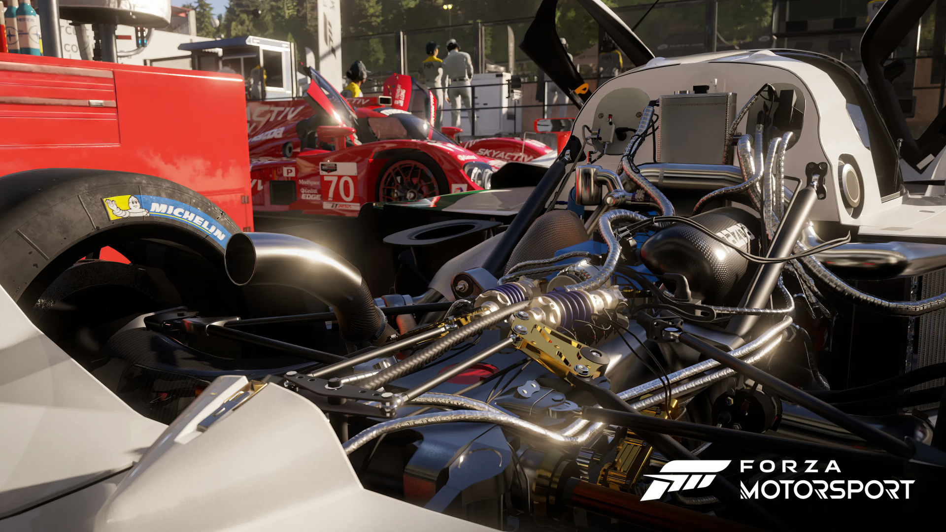 HD desktop wallpaper showcasing the intricate engine details of a race car from Forza Motorsport 2023 video game.