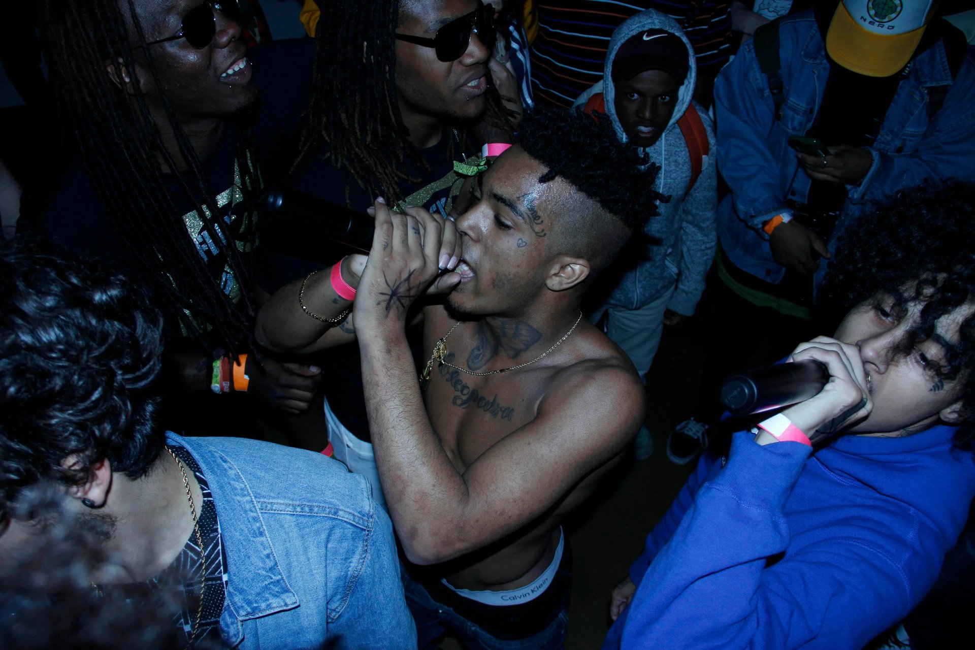 Live music performance featuring XXXTentacion, captured in vivid 4K Ultra HD, creating an immersive PC desktop wallpaper and background experience.