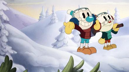 HD PC desktop wallpaper from the TV show The Cuphead Show!: Cuphead and Mugman in winter coats smiling on a snowy hill with frosted pine trees.