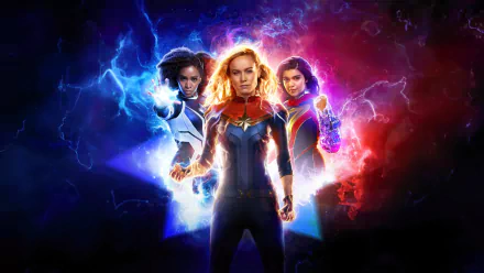 HD desktop wallpaper featuring characters from the movie The Marvels, depicting three superheroes surrounded by vibrant blue and red energy.