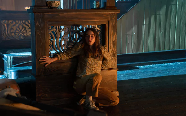 HD wallpaper featuring an intense scene with a person crouching by a decorative frame, tagged No One Will Save You.