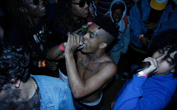 Live music performance featuring XXXTentacion, captured in vivid 4K Ultra HD, creating an immersive PC desktop wallpaper and background experience.