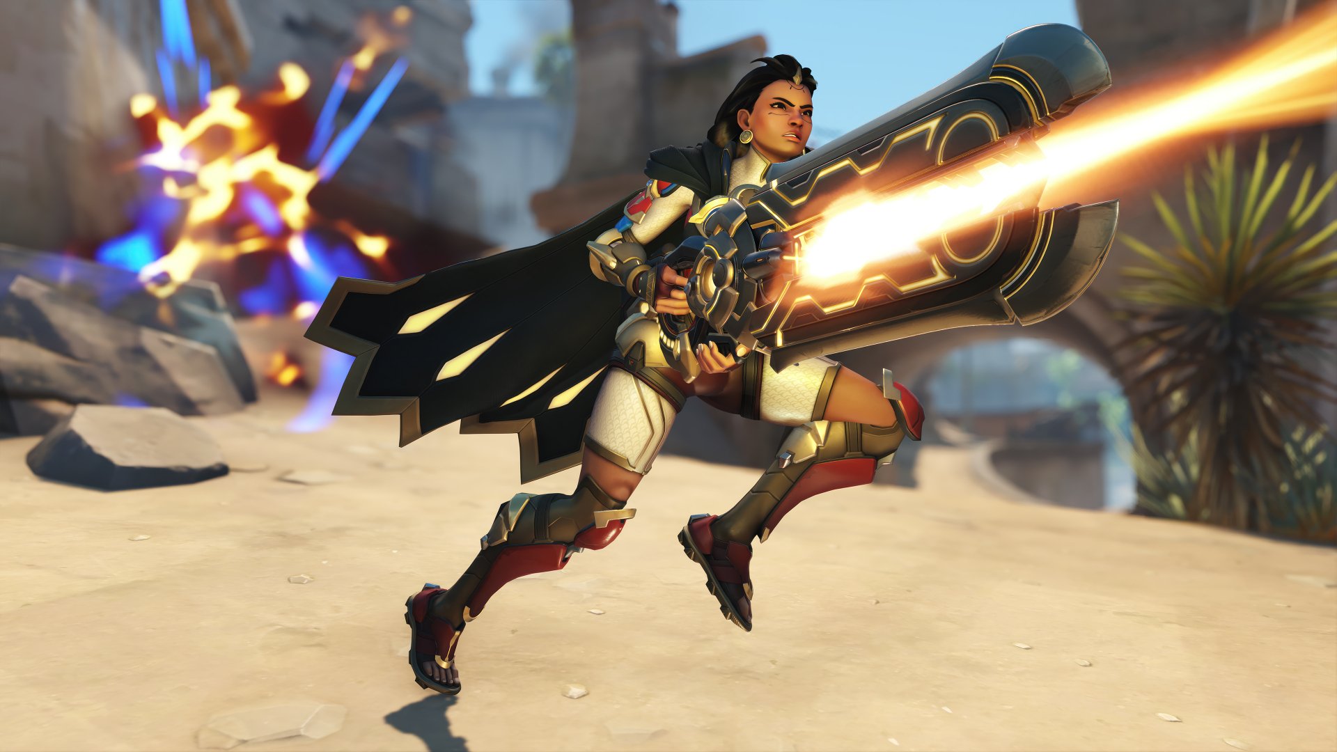 Overwatch 2 character Illari in action on a dynamic HD desktop wallpaper background, showcasing her in mid-battle with vivid visual effects.