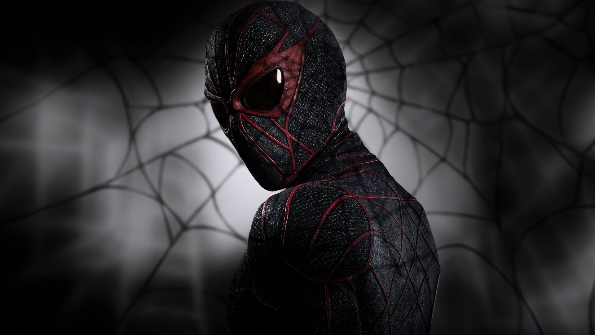 4K Ultra HD wallpaper of Ezekiel Sims from the movie Madame Web, featuring a dark, web-patterned suit with red accents against a blurred spiderweb background.