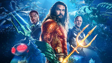 HD wallpaper featuring characters from Aquaman and The Lost Kingdom, showcasing the hero in vibrant costume with a trident, accompanied by allies, against a backdrop of underwater action.