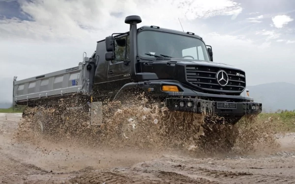 HD PC desktop wallpaper and background: Mercedes‑Benz Zetros truck splashing through mud, a rugged off‑road vehicle under a cloudy sky.