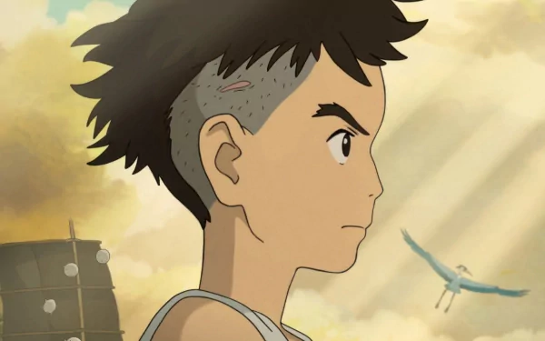 HD desktop wallpaper featuring a side profile of an animated boy looking towards a flying heron against a warm, cloudy backdrop, tagged 'The Boy and the Heron'.