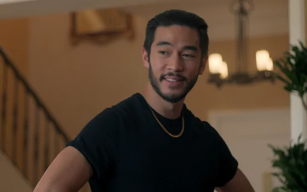 HD desktop wallpaper featuring a male character from the TV show The Brothers Sun, posed in a well-lit interior setting with a staircase in the background.