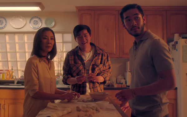 HD desktop wallpaper from The Brothers Sun TV show featuring three characters cooking together in a kitchen.