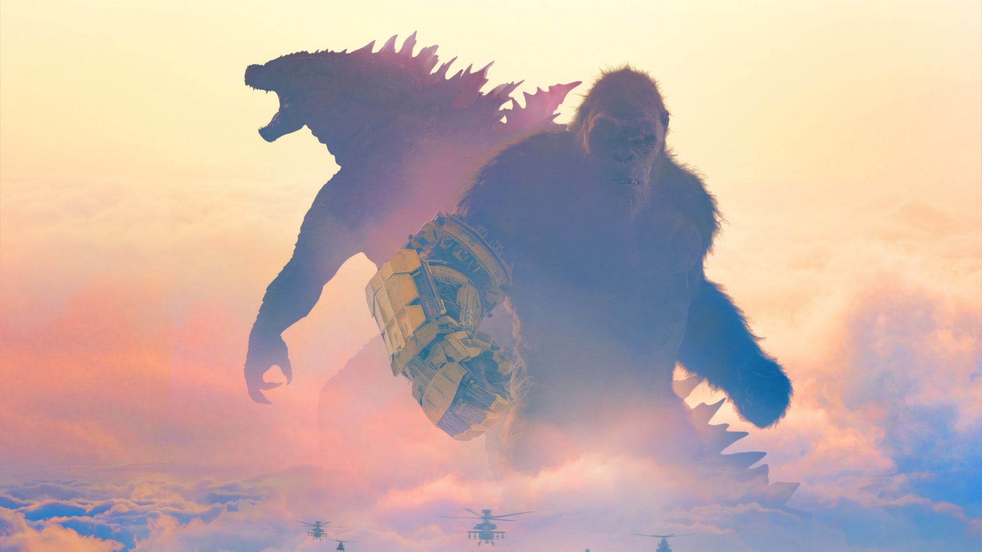 HD desktop wallpaper featuring silhouettes of Godzilla and King Kong from the movie 'Godzilla x Kong: The New Empire' set against a vivid sunset sky.