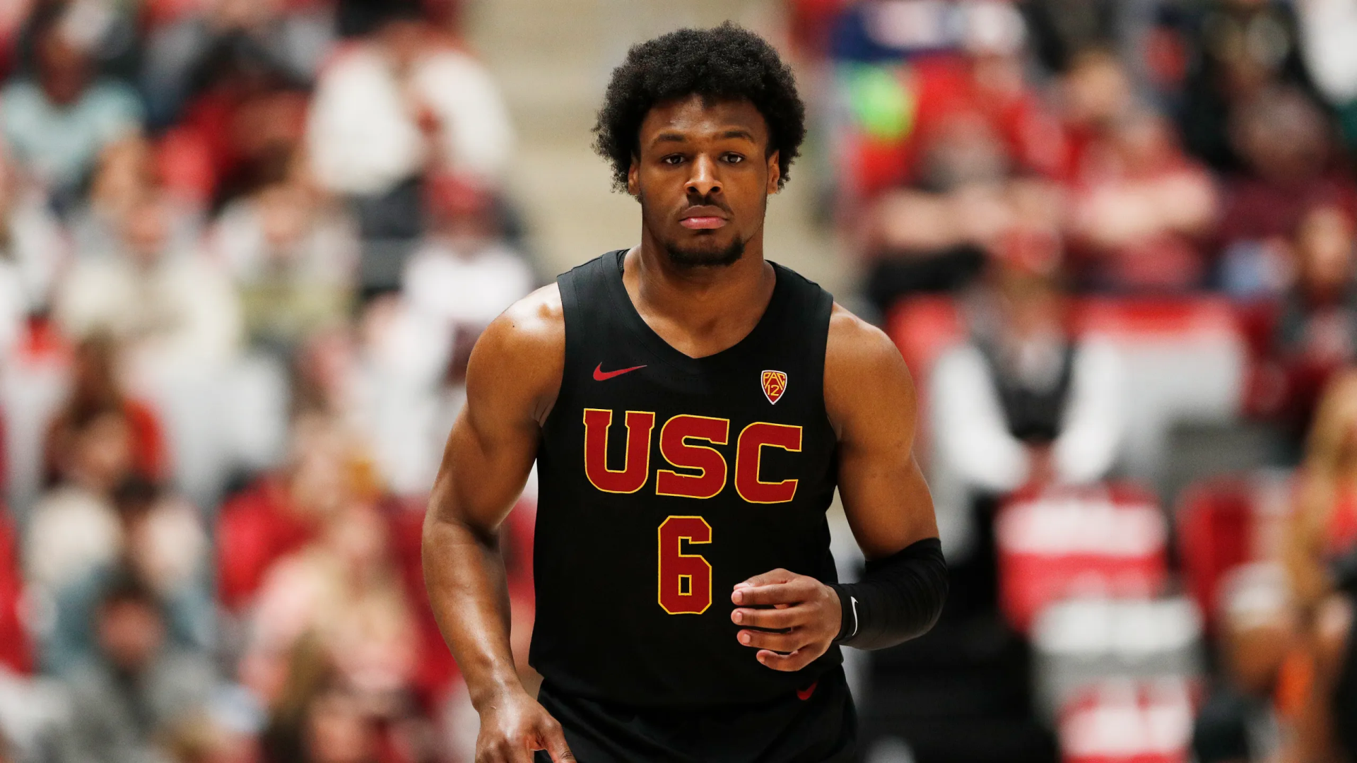 HD desktop wallpaper featuring a basketball player in a USC jersey with the number 6, on the court, tagged as Bronny James.
