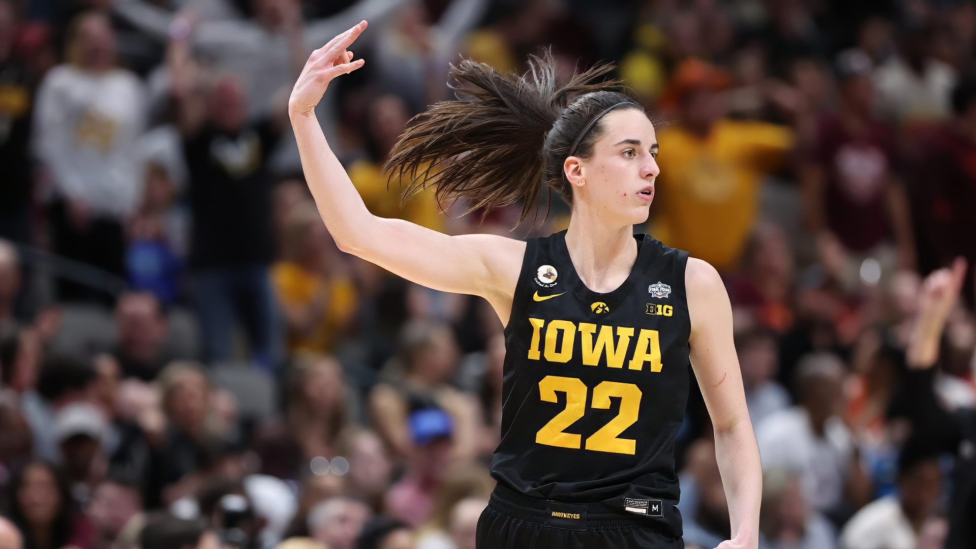 HD desktop wallpaper featuring basketball player Caitlin Clark in an Iowa jersey mid-action on the court.