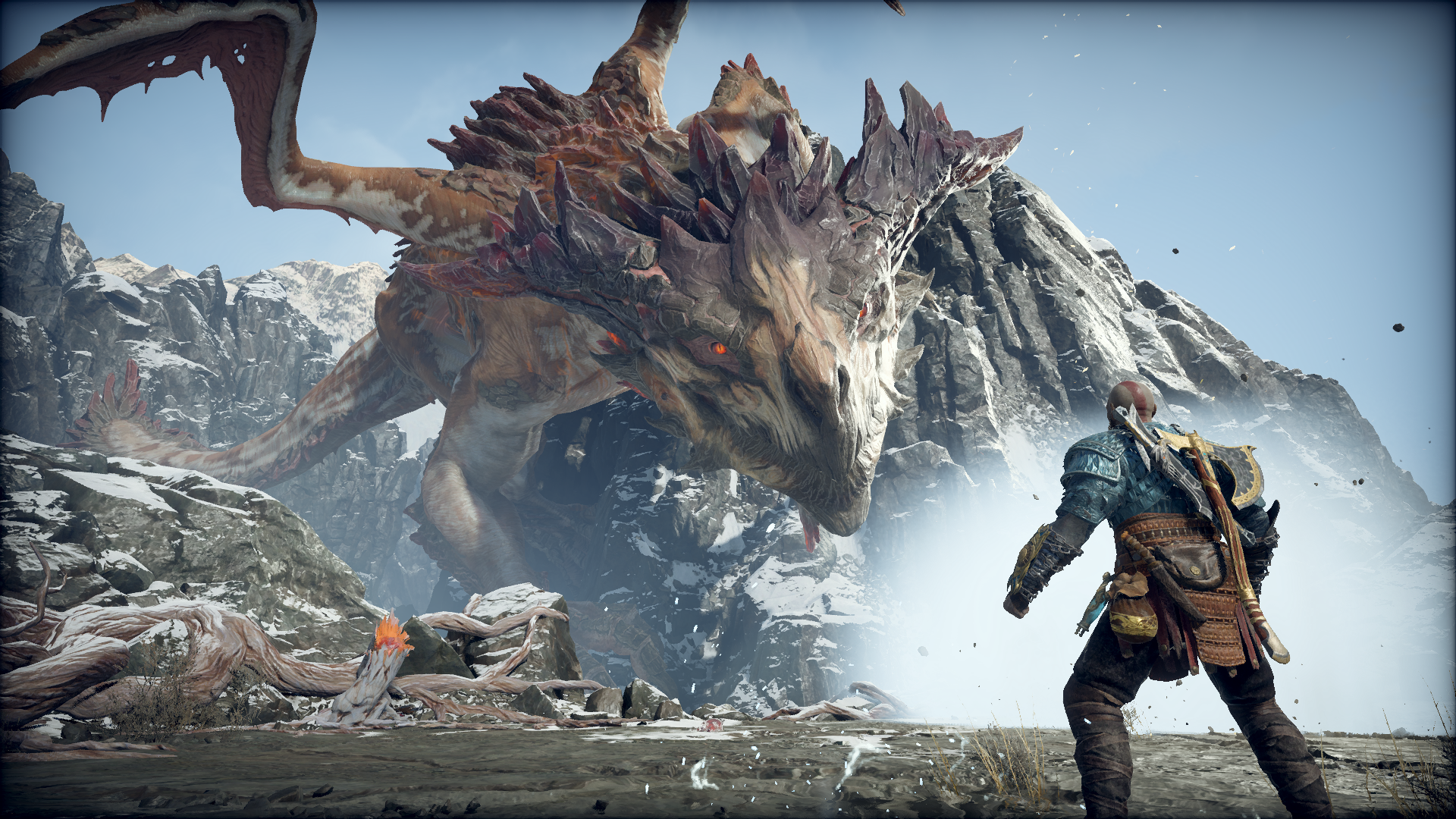 HD PC desktop wallpaper featuring Kratos from God of War facing a large, menacing dragon in a snowy mountainous landscape.