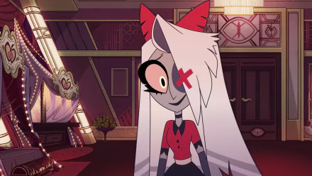 HD desktop wallpaper featuring Vaggie from the TV show Hazbin Hotel. She stands in a stylish room, showcasing her unique character design with a playful expression.