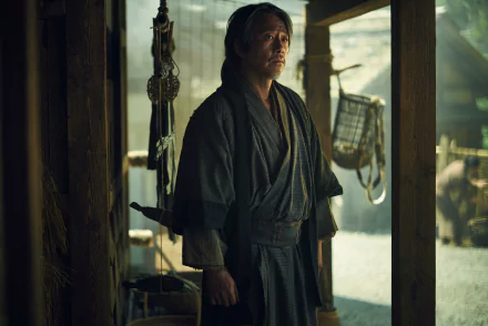 HD wallpaper featuring a scene from the 2024 TV show Shogun with a character dressed in traditional samurai attire standing thoughtfully in a Japanese dwelling.