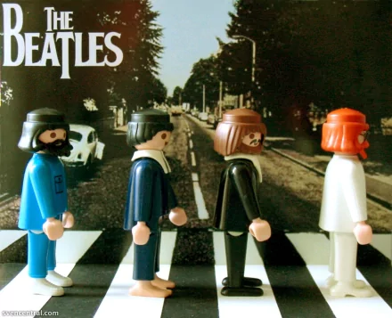 A vibrant HD desktop wallpaper featuring Playmobil figurines representing The Beatles, styled against a backdrop reminiscent of their iconic album cover.