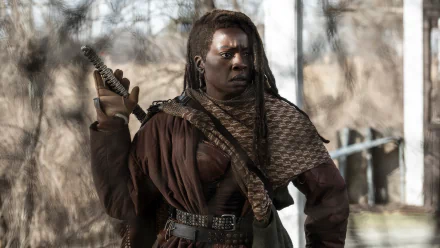 HD Wallpaper of a determined female warrior from The Walking Dead: The Ones Who Live, standing ready for action in a post-apocalyptic setting.