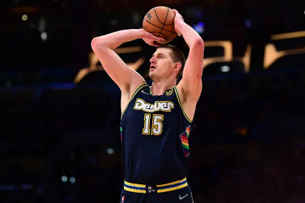 HD desktop wallpaper featuring an action shot of a Denver Nuggets basketball player poised to make a shot during an NBA game.