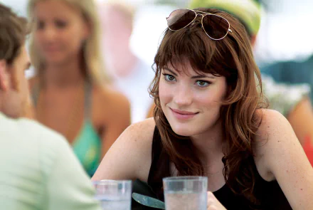 HD desktop wallpaper featuring a still from the TV show Dexter with actress Jennifer Carpenter in a candid scene.