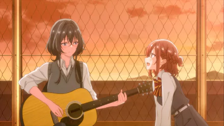 HD wallpaper of two anime characters from 'Whisper Me a Love Song' with one holding a guitar and the other speaking, both behind a fence with a warm, sunset-like glow.