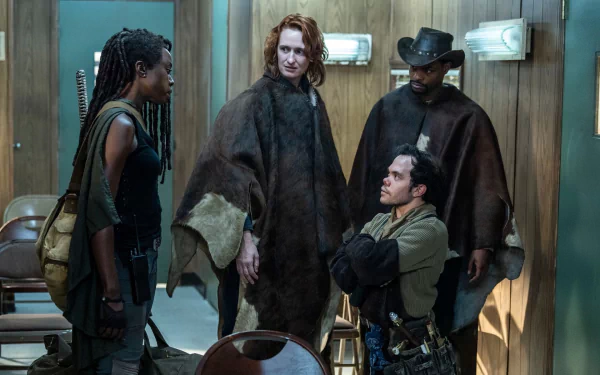 HD wallpaper featuring a dramatic scene from the TV show The Walking Dead: The Ones Who Live, with intense characters engaged in conversation in a dimly lit room.