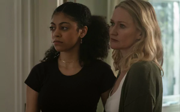 HD wallpaper featuring two characters from the 2024 TV show Parish, showing a focused scene with a young woman and an older woman side by side in an indoor setting.