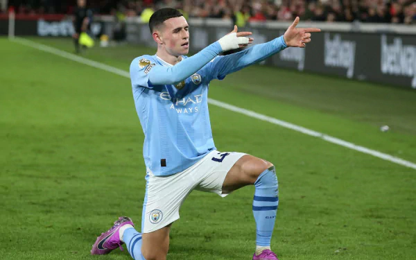 Manchester City F.C. player celebrating on the soccer field HD wallpaper