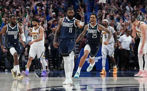 HD wallpaper featuring Kyrie Irving and the Dallas Mavericks in action during an NBA basketball game.