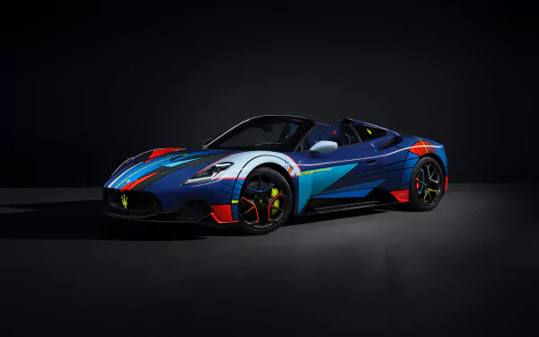 A Maserati MC20 sports car with a distinctive blue and red livery, poised on a dark background suitable as an HD desktop wallpaper.