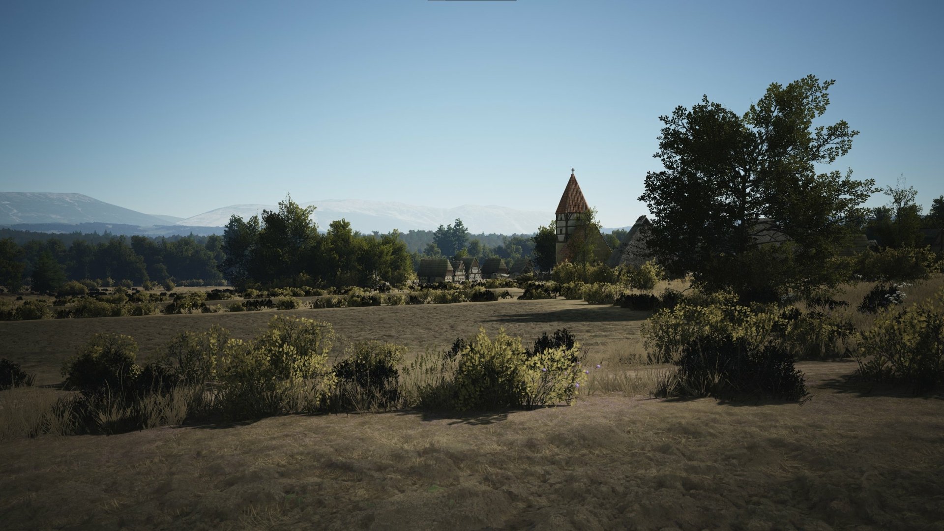 HD desktop wallpaper from the video game Manor Lords featuring a serene medieval landscape with a pointed tower and lush fields under a clear sky.