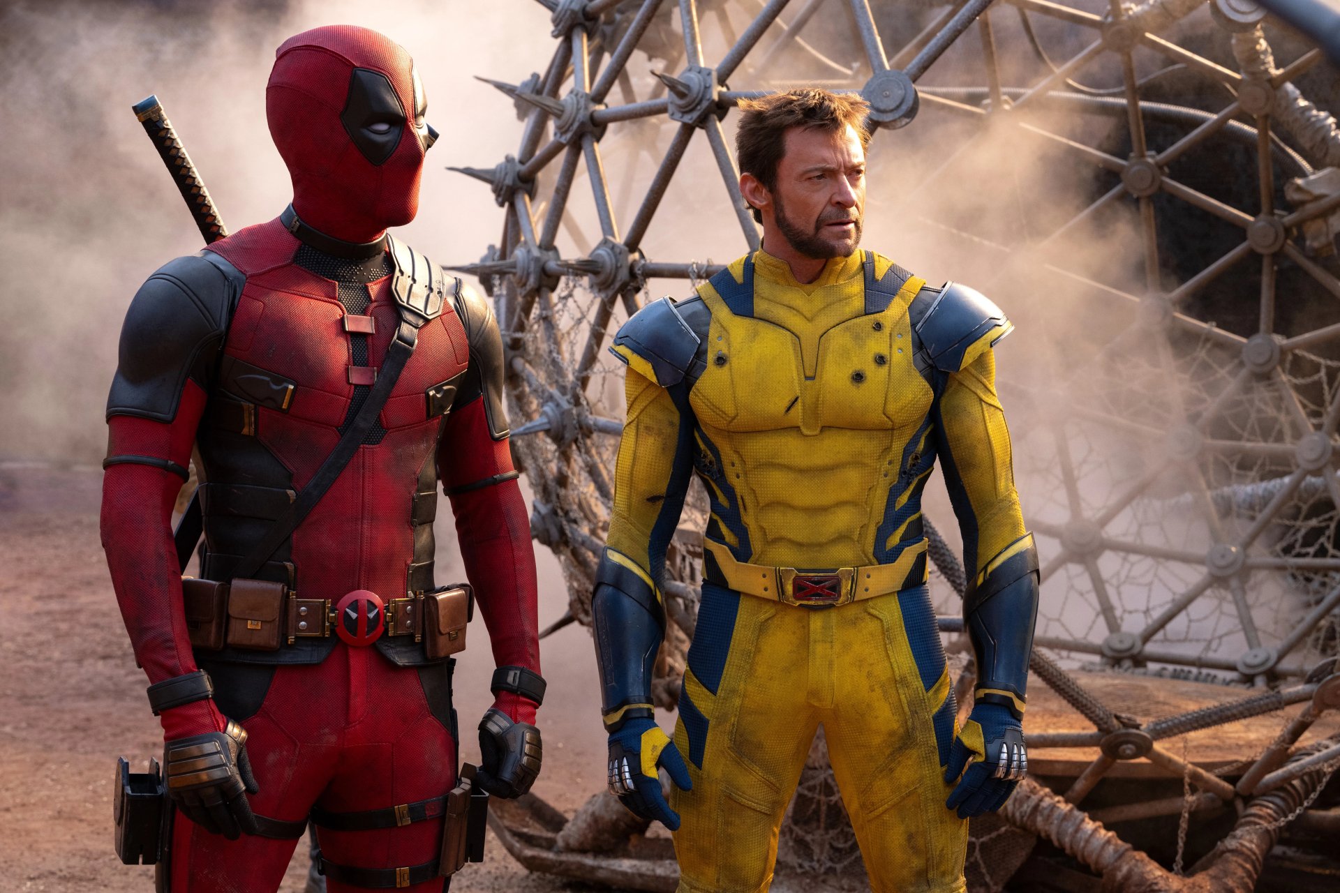 Deadpool and Wolverine stand side by side in a dynamic 8K Ultra HD PC desktop wallpaper, showcasing their iconic costumes and intense expressions amidst a rugged background.