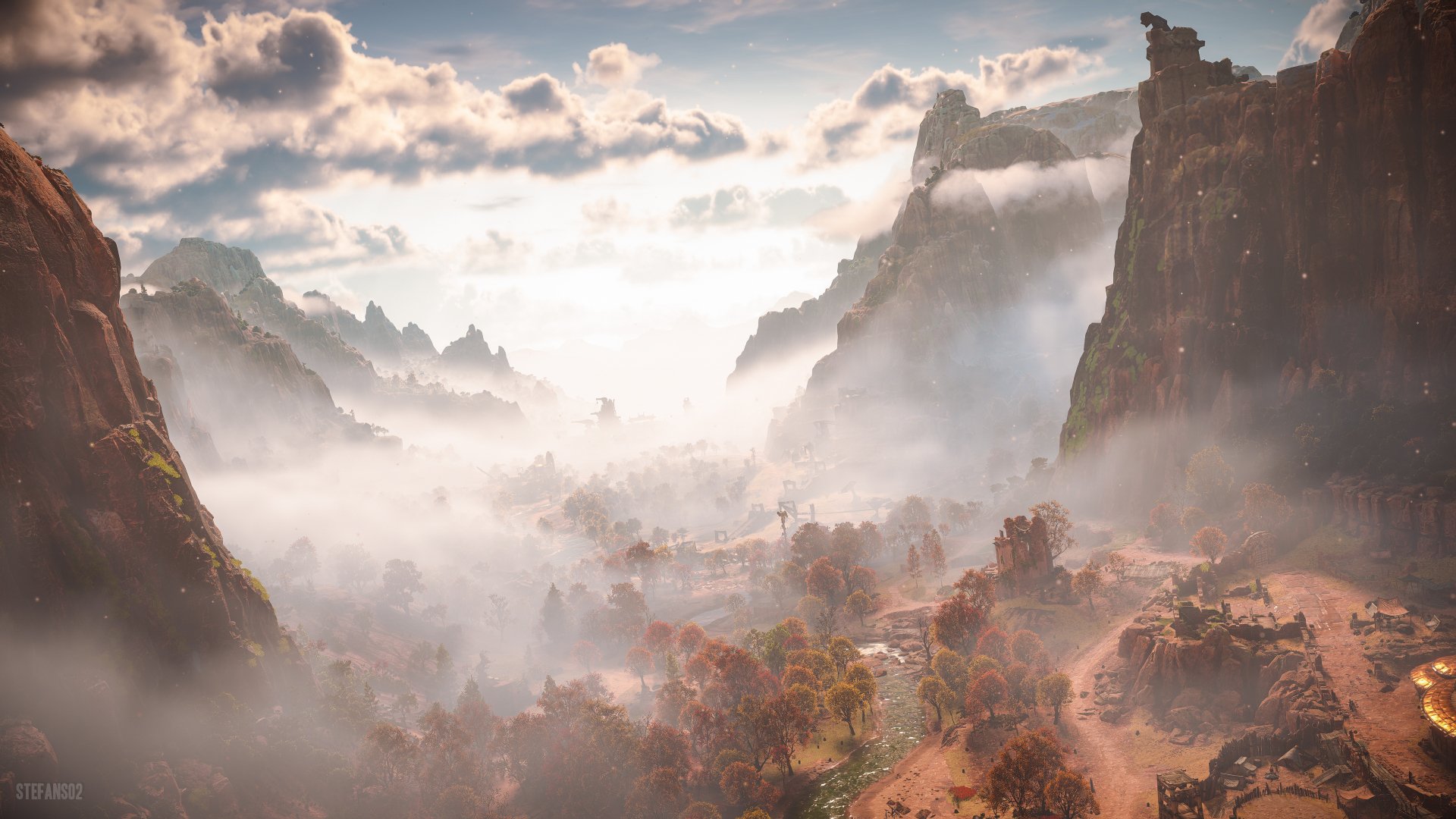 A breathtaking 4K Ultra HD PC desktop wallpaper from Horizon Forbidden West, showcasing a misty valley framed by towering cliffs under a cloudy sky.