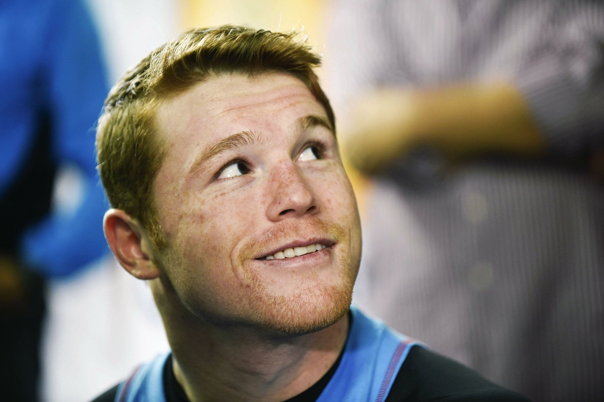 HD desktop wallpaper featuring Canelo Álvarez smiling, with a blurred background, enhancing focus on his face.